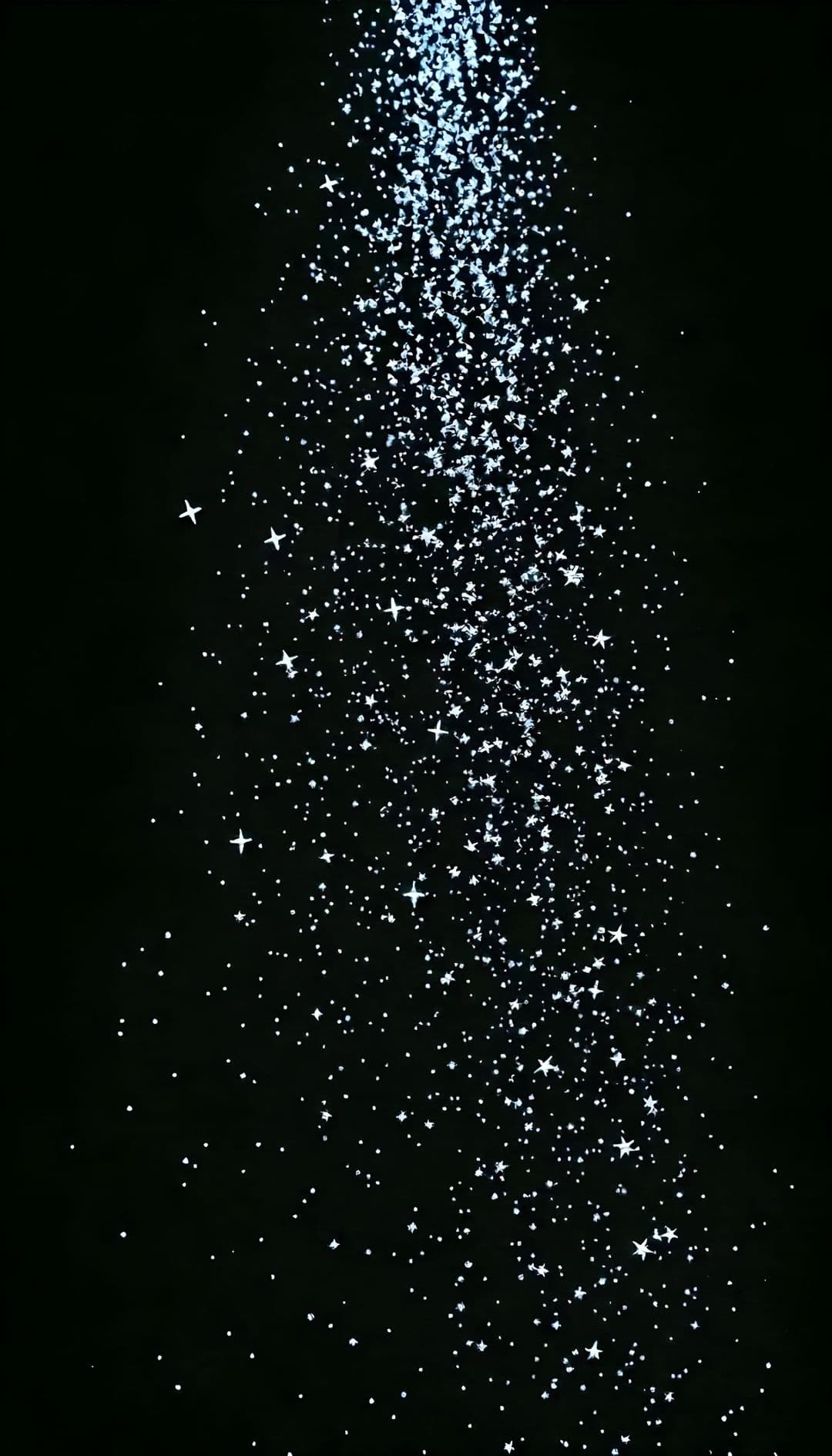 Stars and luminous particles on black background