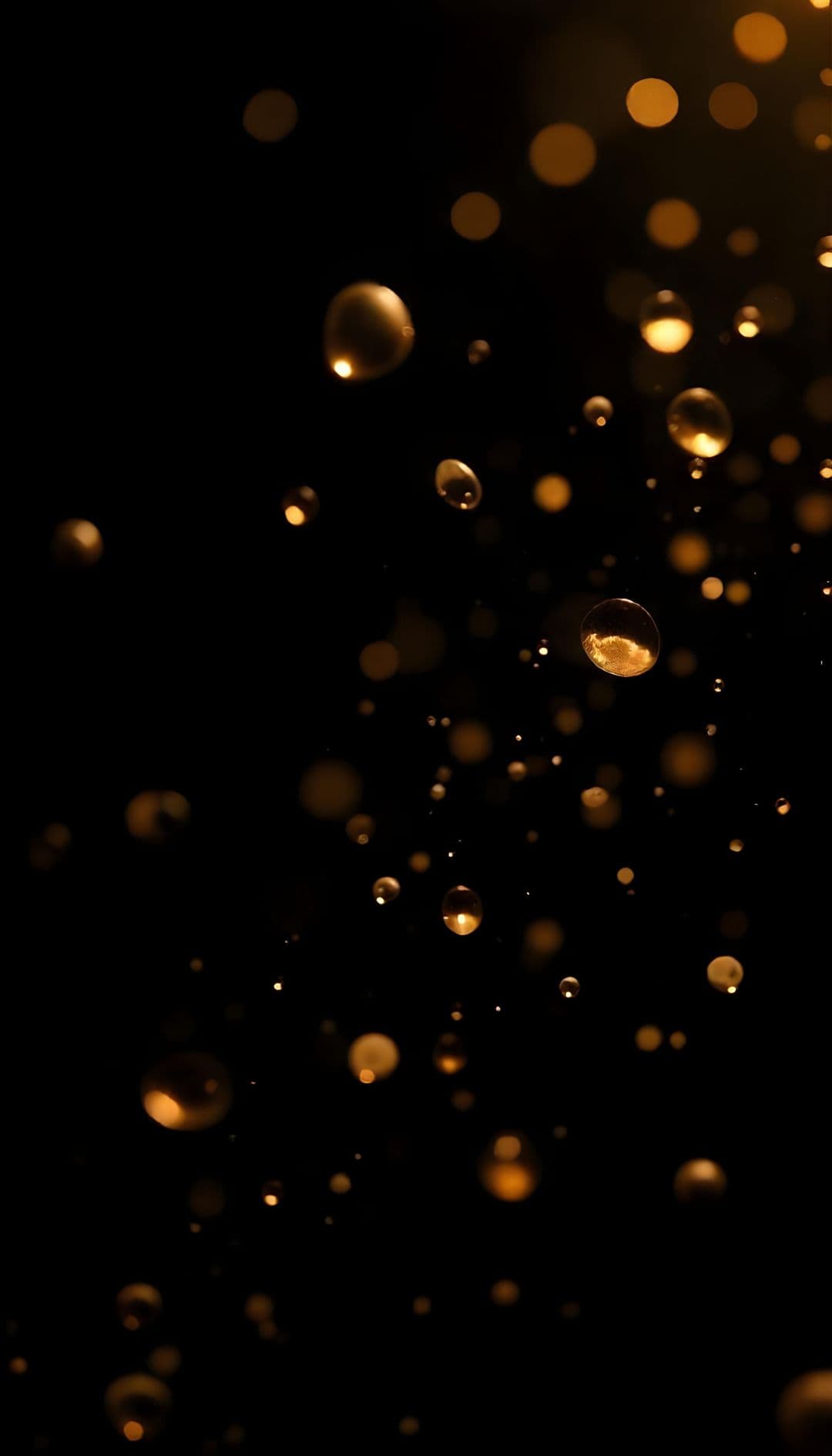Cascading golden bokeh lights on a dark background